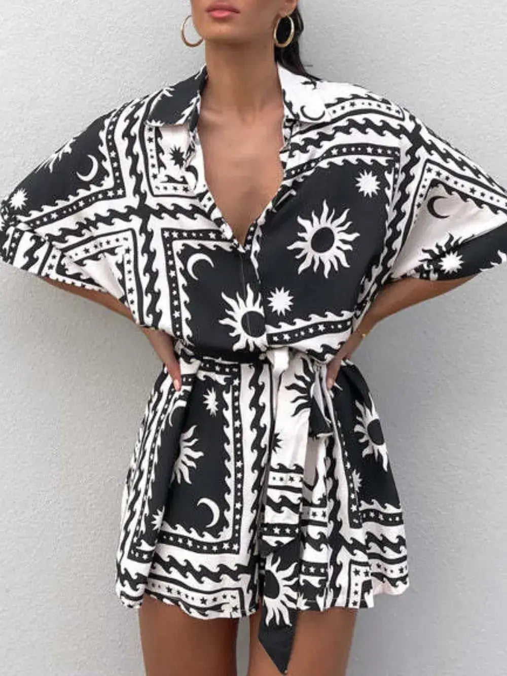 Printed tie waist half sleeve romper with sun and moon pattern in black and white